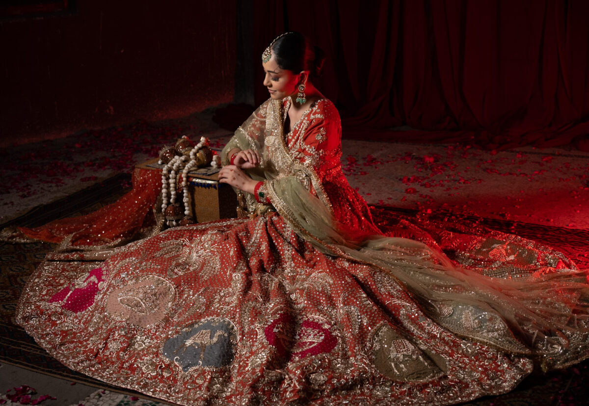 Best seller orange wedding lehengas by Kulwinder Nagra